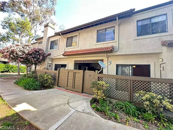 front view of a house with a garden