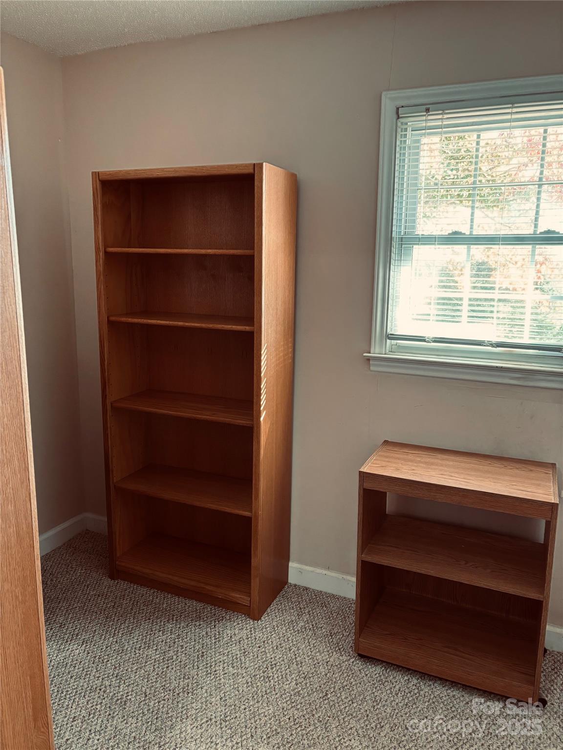 4211 Wolf Pond Road Monroe, NC 28112 - Photo 15 of 36 a room with a furniture and a window
