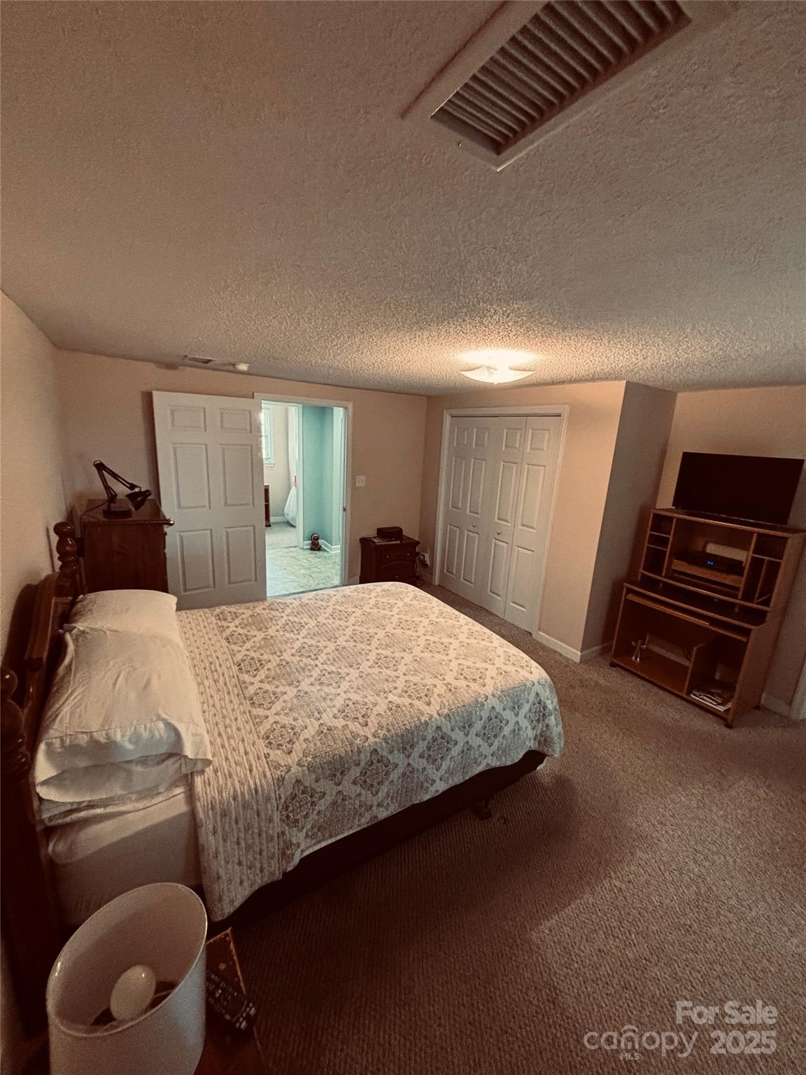 4211 Wolf Pond Road Monroe, NC 28112 - Photo 19 of 36 a bed sitting in a bedroom and room
