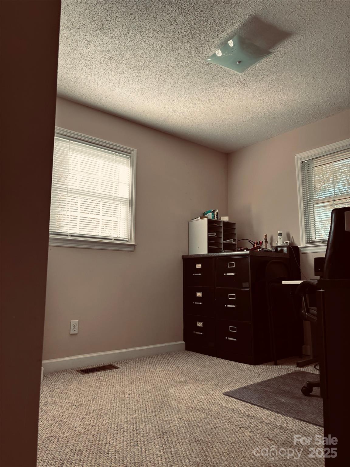 4211 Wolf Pond Road Monroe, NC 28112 - Photo 25 of 36 a room with a dresser and a window