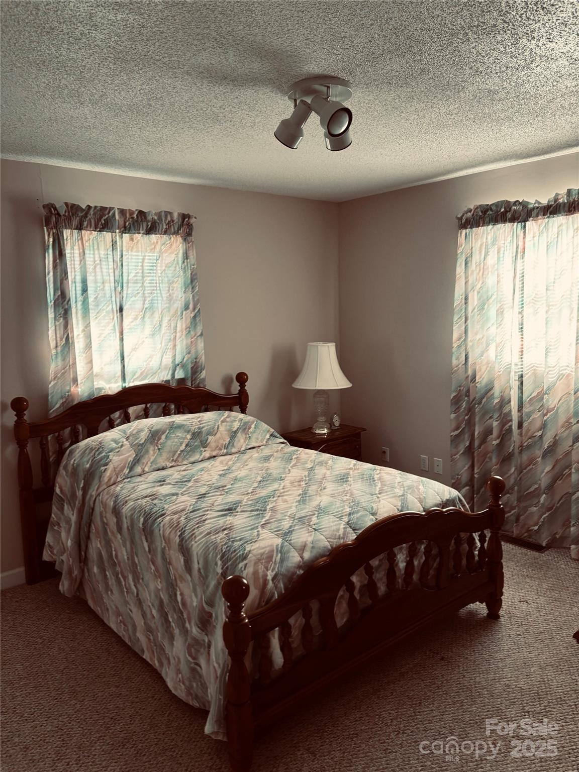4211 Wolf Pond Road Monroe, NC 28112 - Photo 27 of 36 a bedroom with a bed and window