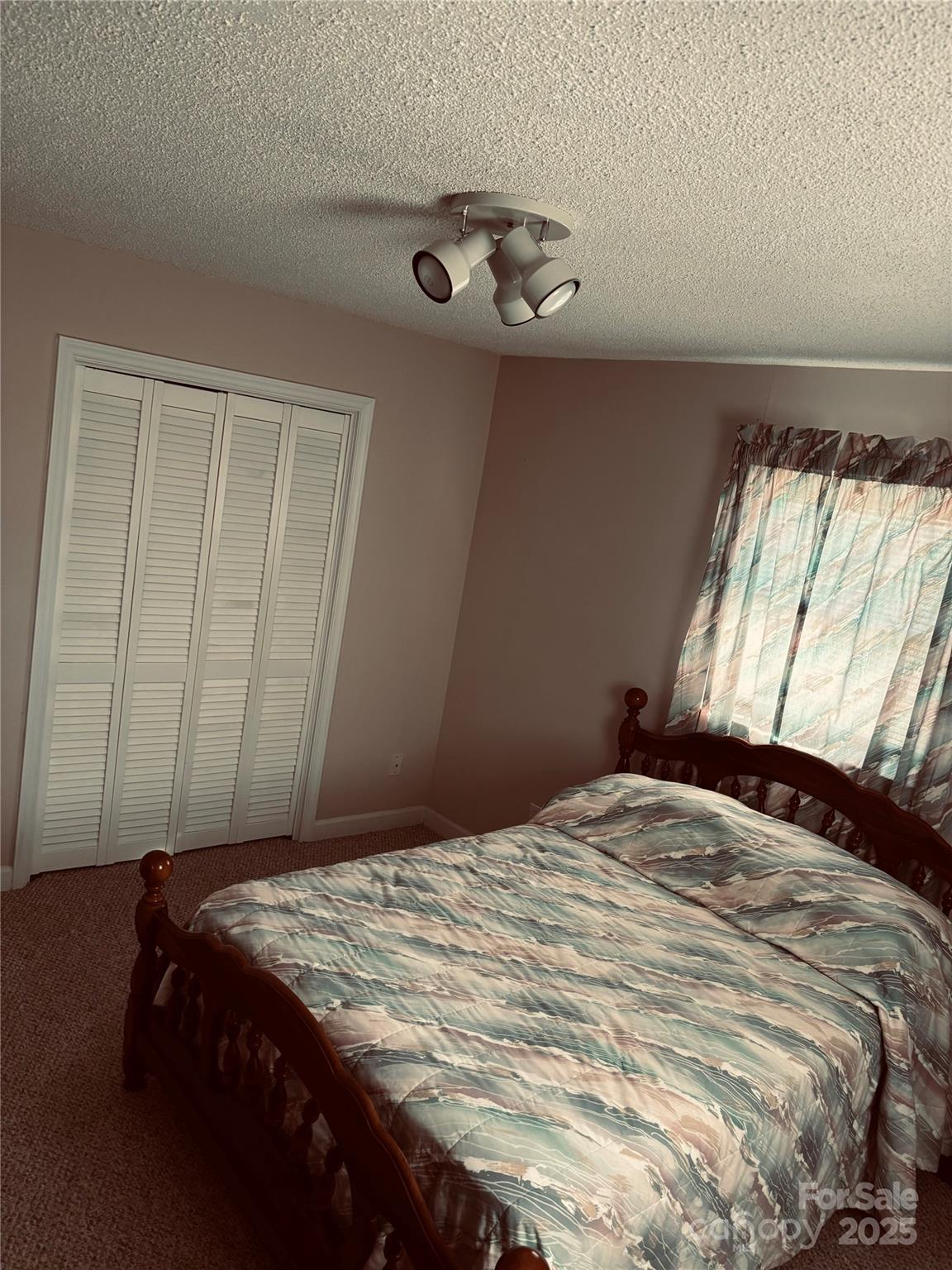 4211 Wolf Pond Road Monroe, NC 28112 - Photo 28 of 36 a bedroom with a bed and a window