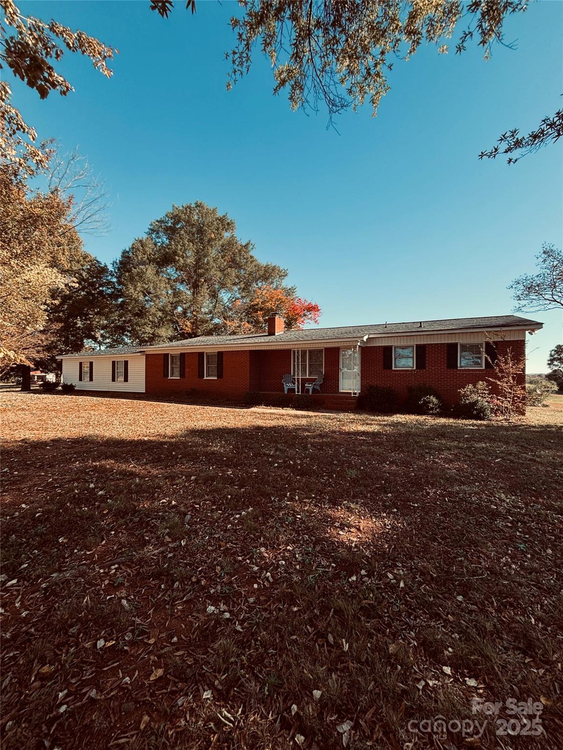 4211 Wolf Pond Road Monroe, NC 28112 - Photo 3 of 36 a front view of a house with a yard