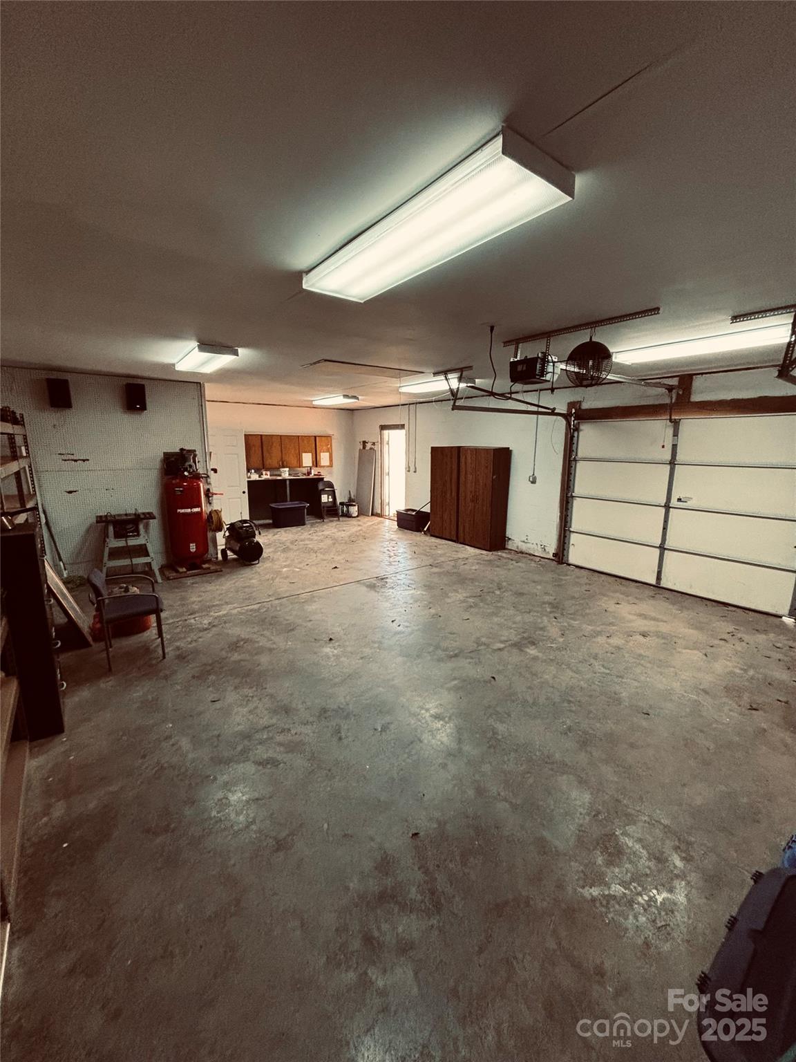 4211 Wolf Pond Road Monroe, NC 28112 - Photo 35 of 36 a view of a garage with furniture