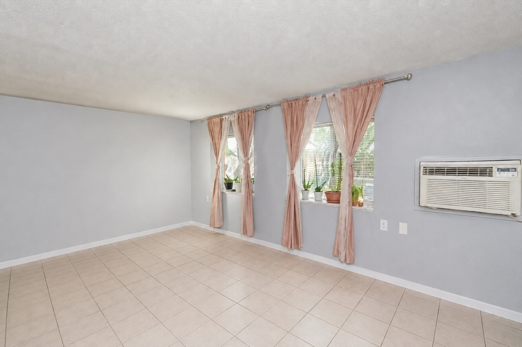 2 Universal Street, Unit 4 Framingham, MA 01702 - Photo 3 of 18 a view of an empty room with a window