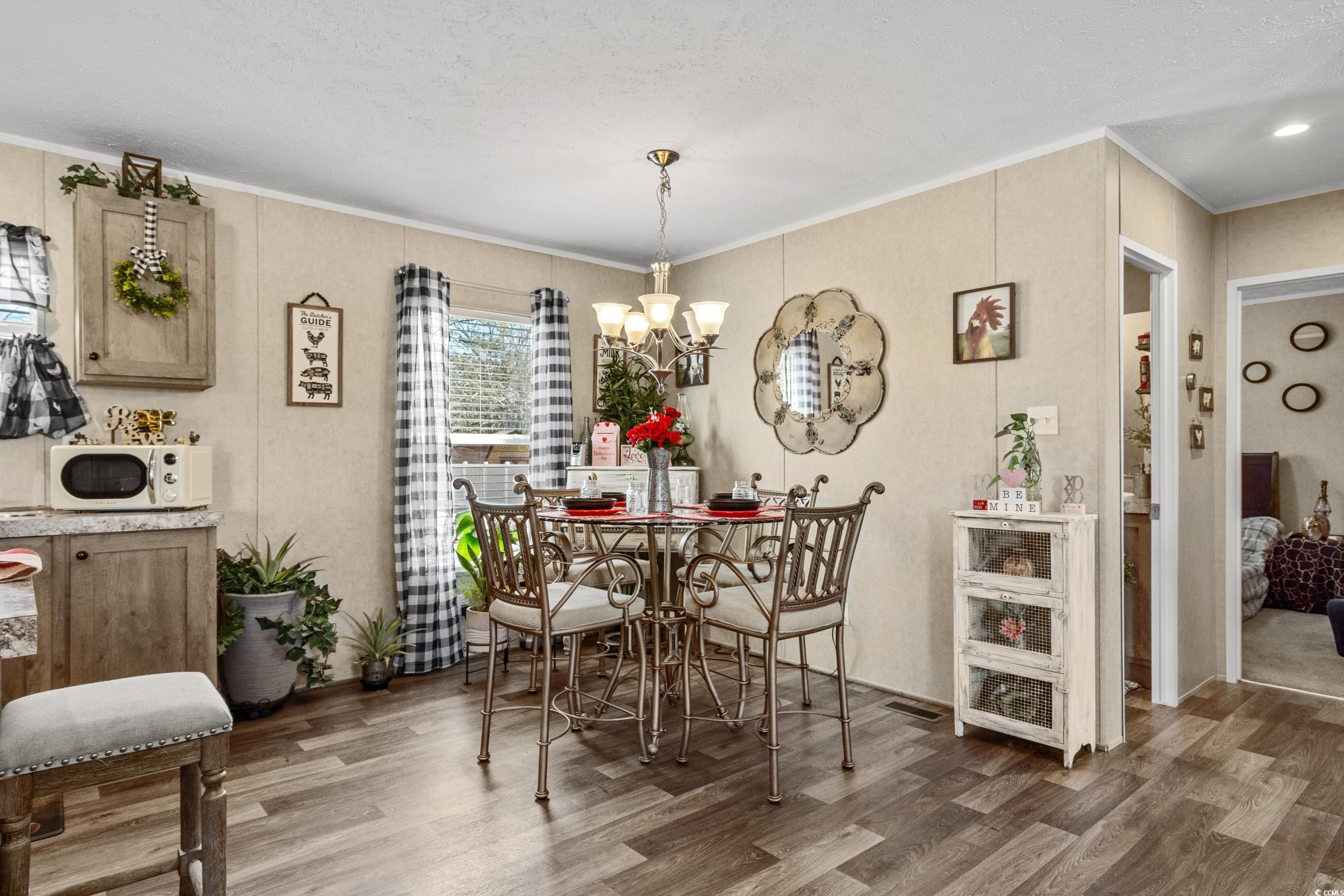3367 Fries Bay Road Loris, SC 29569 - Photo 8 of 40 Dining space with dark hardwood / wood-style floor
