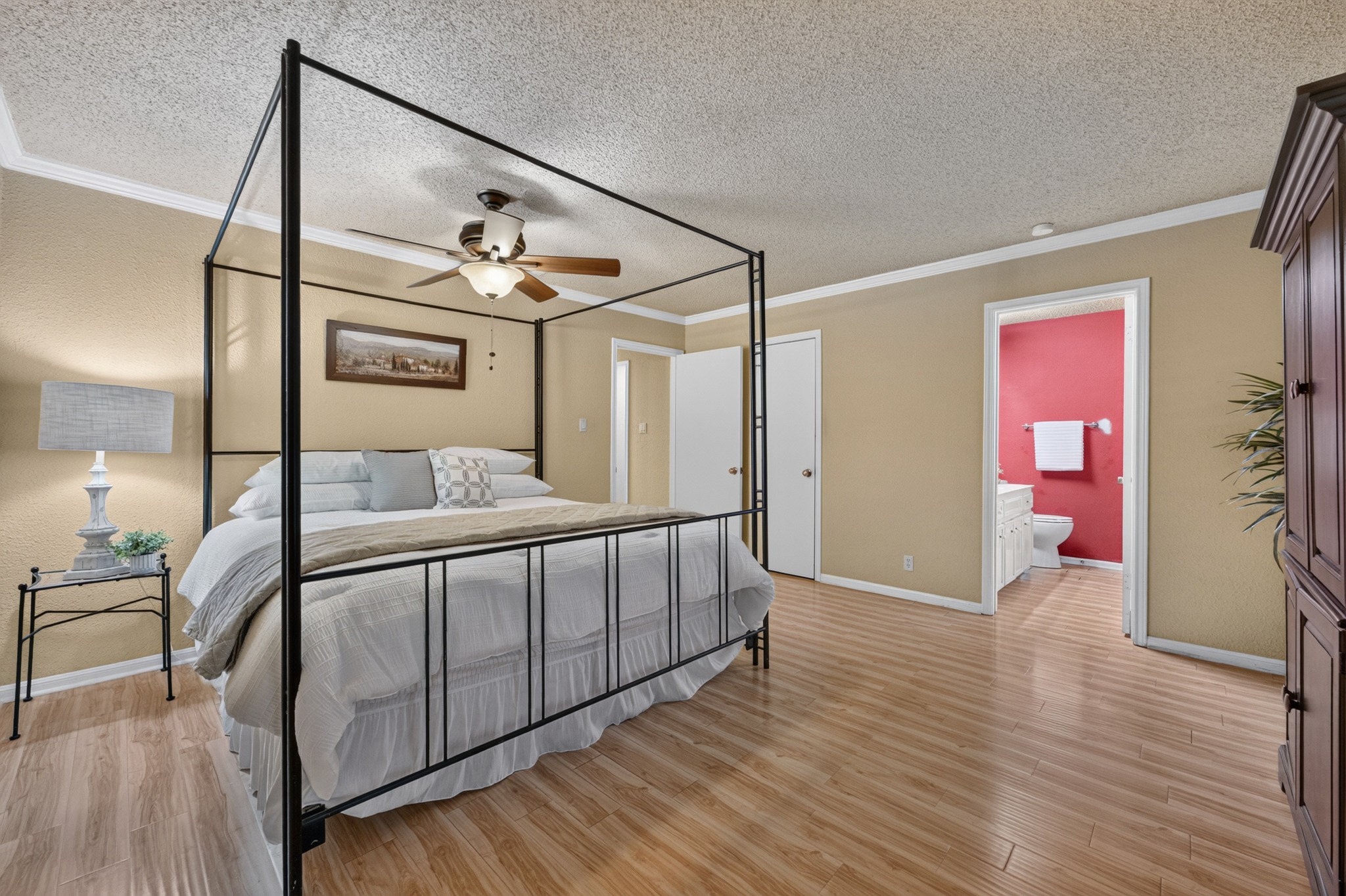 1907 Stoneridge Road Austin, TX 78746 - Photo 19 of 36 Comfortable primary suite with private bathroom access.