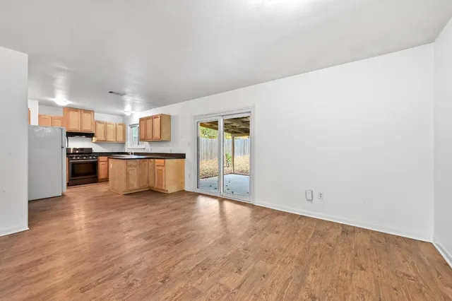a view of kitchen with wooden floor