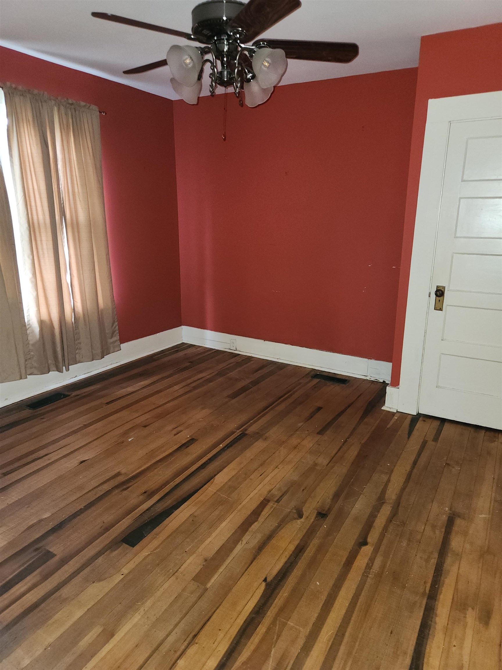 450 Fletcher Road Collierville, TN 38017 - Photo 18 of 25 a view of an empty room with wooden floor and a window