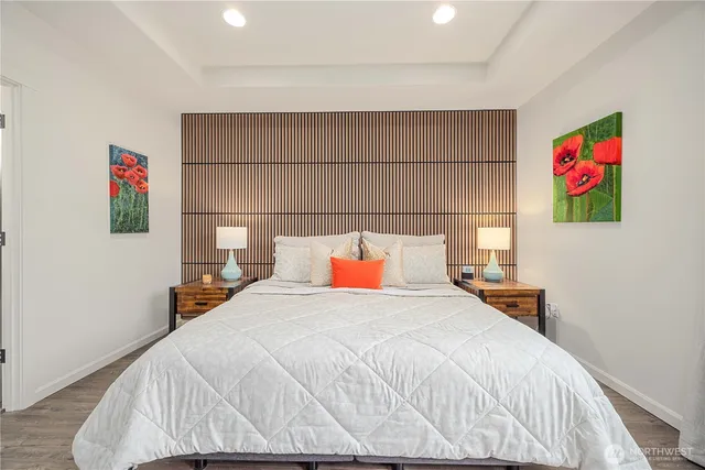 a bedroom with a bed and cabinets