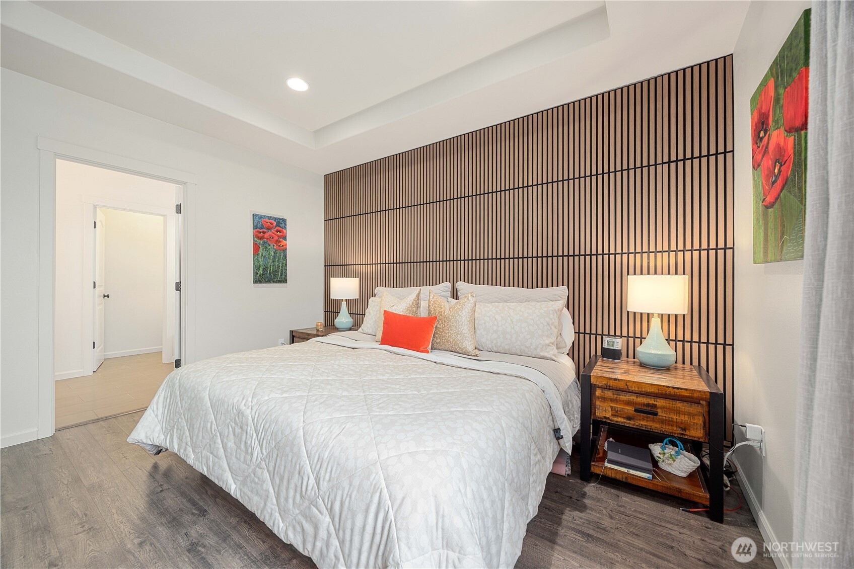 457 Whisper Place Chelan, WA 98816 - Photo 27 of 40 a bedroom with a bed and a window