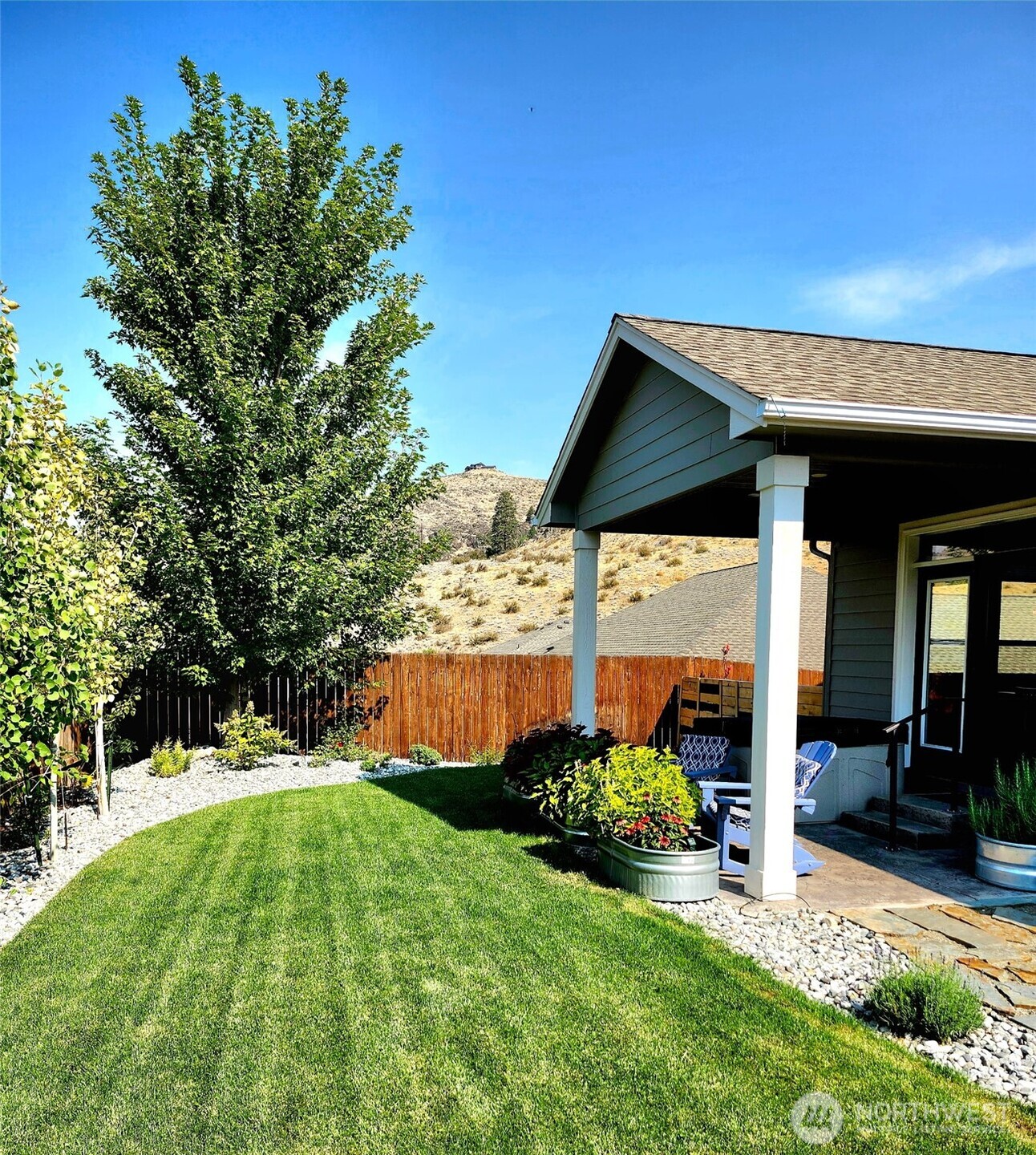 457 Whisper Place Chelan, WA 98816 - Photo 32 of 40 a garden view with a seating space