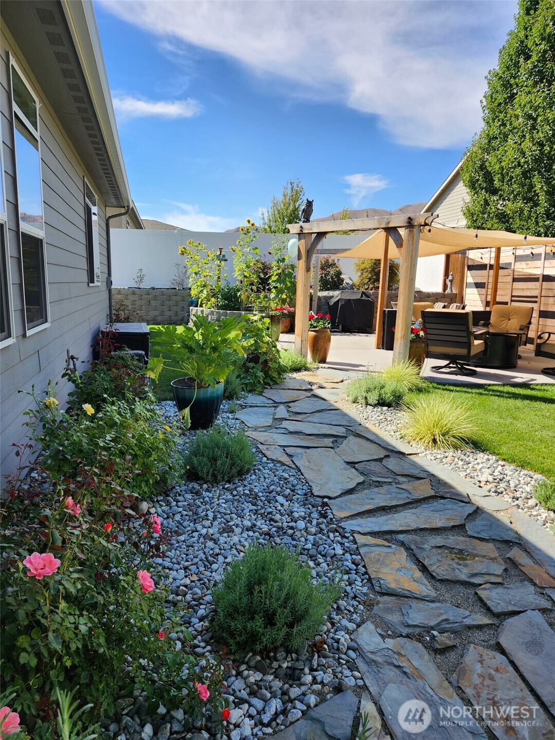 457 Whisper Place Chelan, WA 98816 - Photo 34 of 40 a view of a house with a garden
