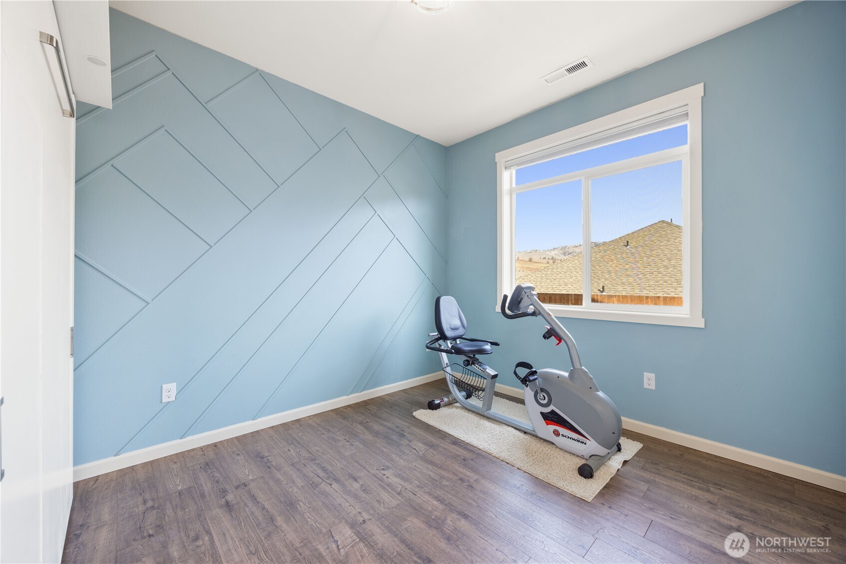 457 Whisper Place Chelan, WA 98816 - Photo 7 of 40 a room with gym equipment and view of living room