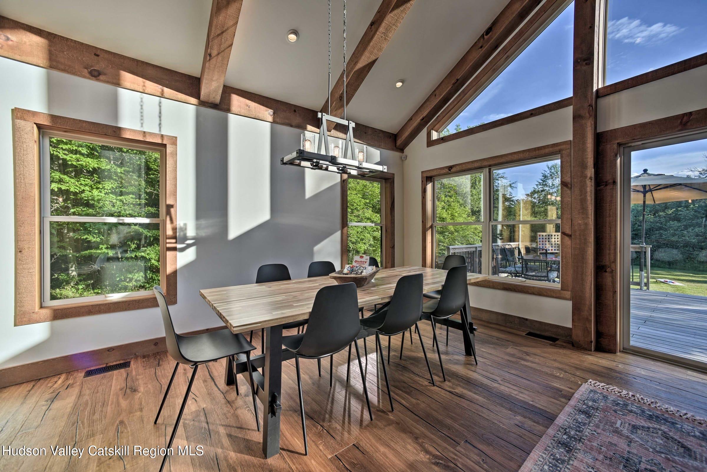 205 Nauvoo Road Windham, NY 12496 - Photo 14 of 31 a view of a dining room with furniture window and wooden floor