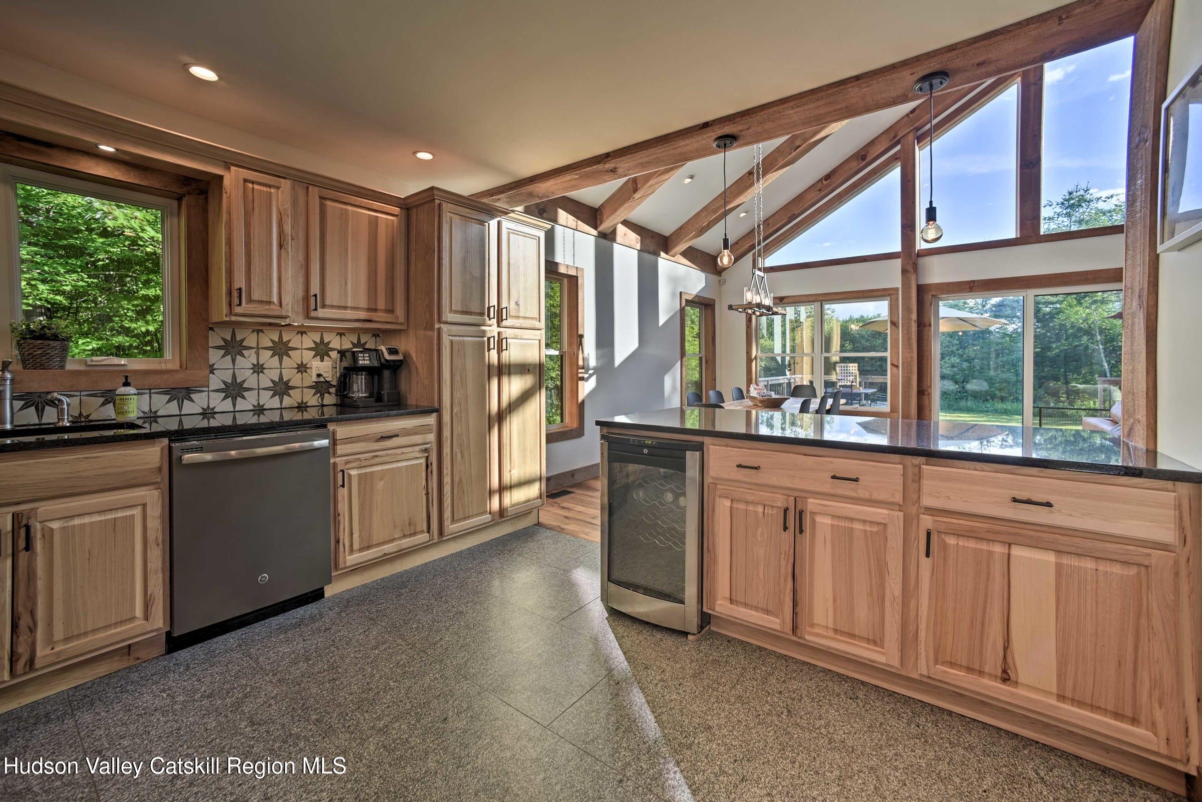 205 Nauvoo Road Windham, NY 12496 - Photo 17 of 31 a kitchen with sink a window and cabinets