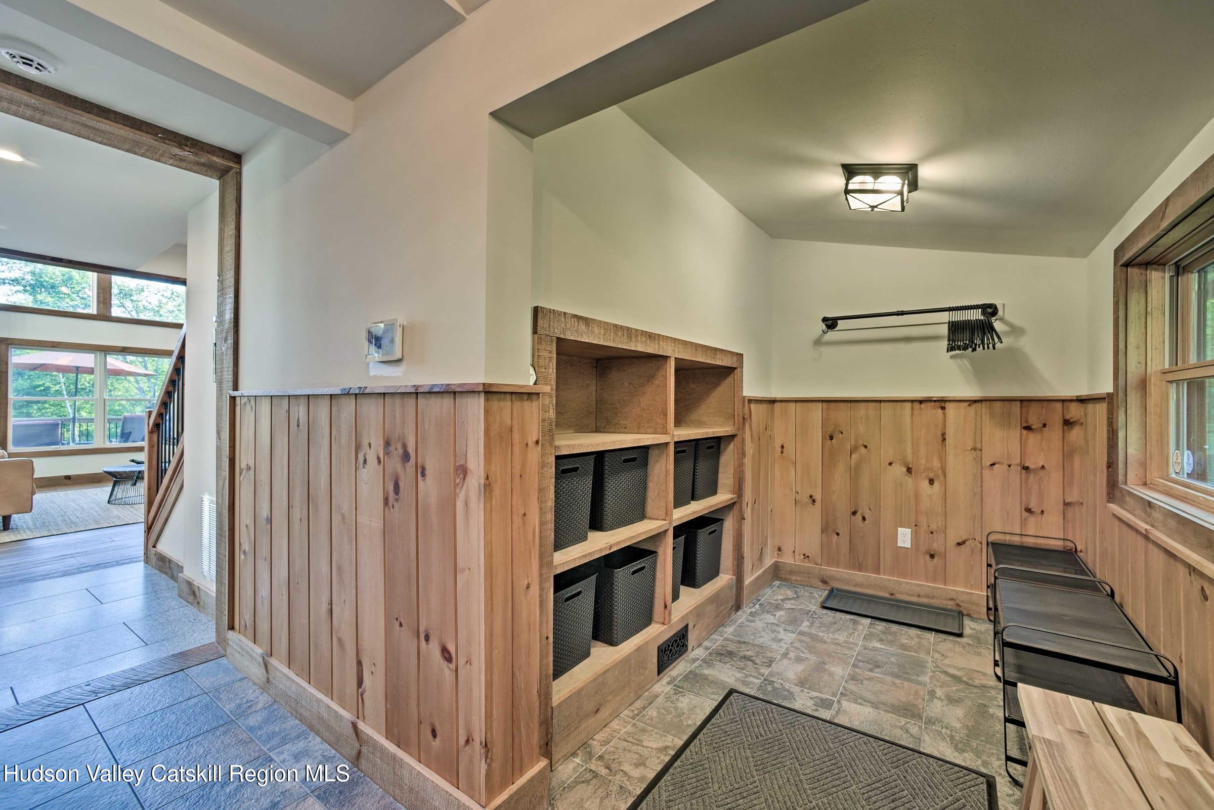 205 Nauvoo Road Windham, NY 12496 - Photo 20 of 31 a view of a livingroom with furniture and staircase