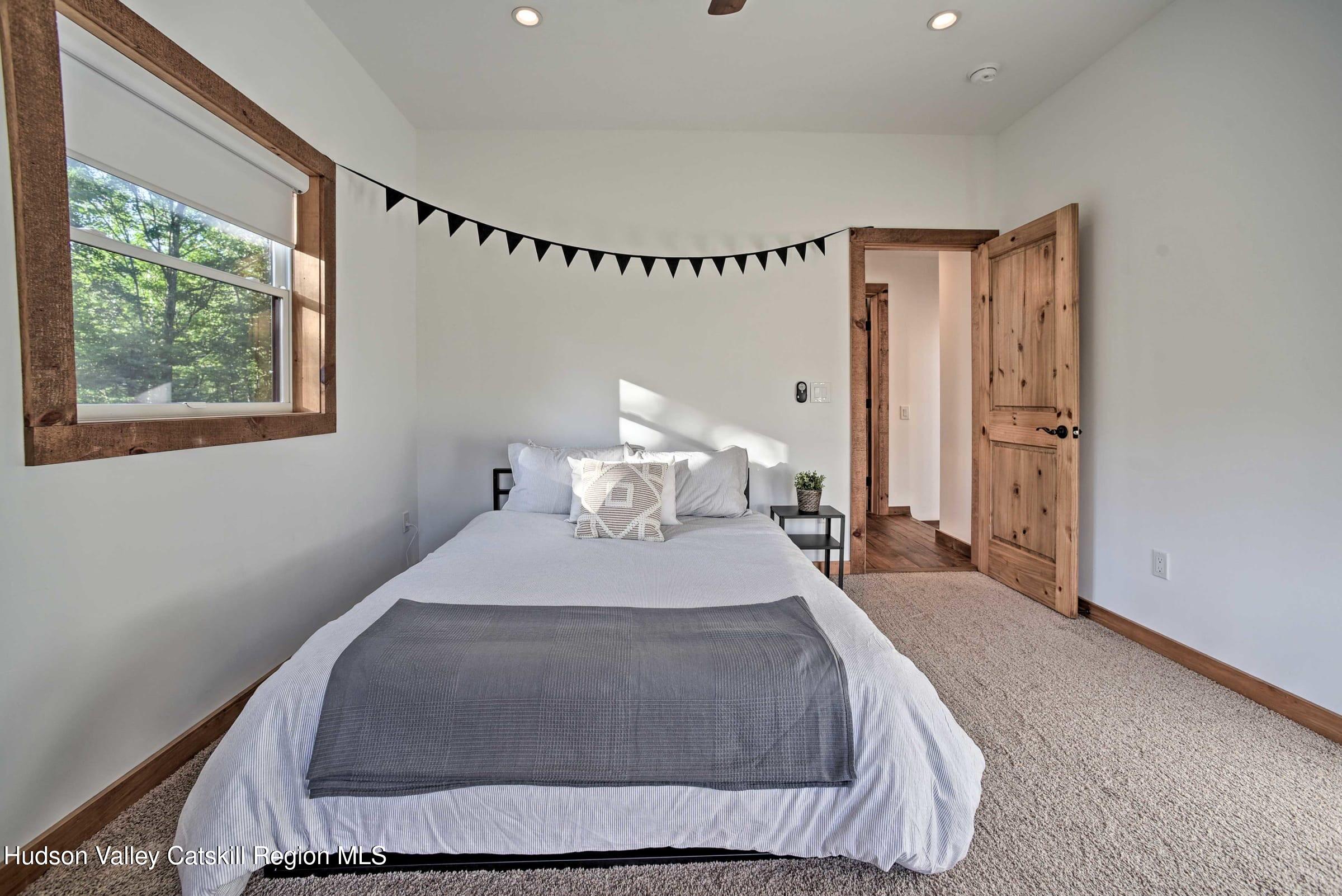 205 Nauvoo Road Windham, NY 12496 - Photo 23 of 31 a bedroom with a bed and window