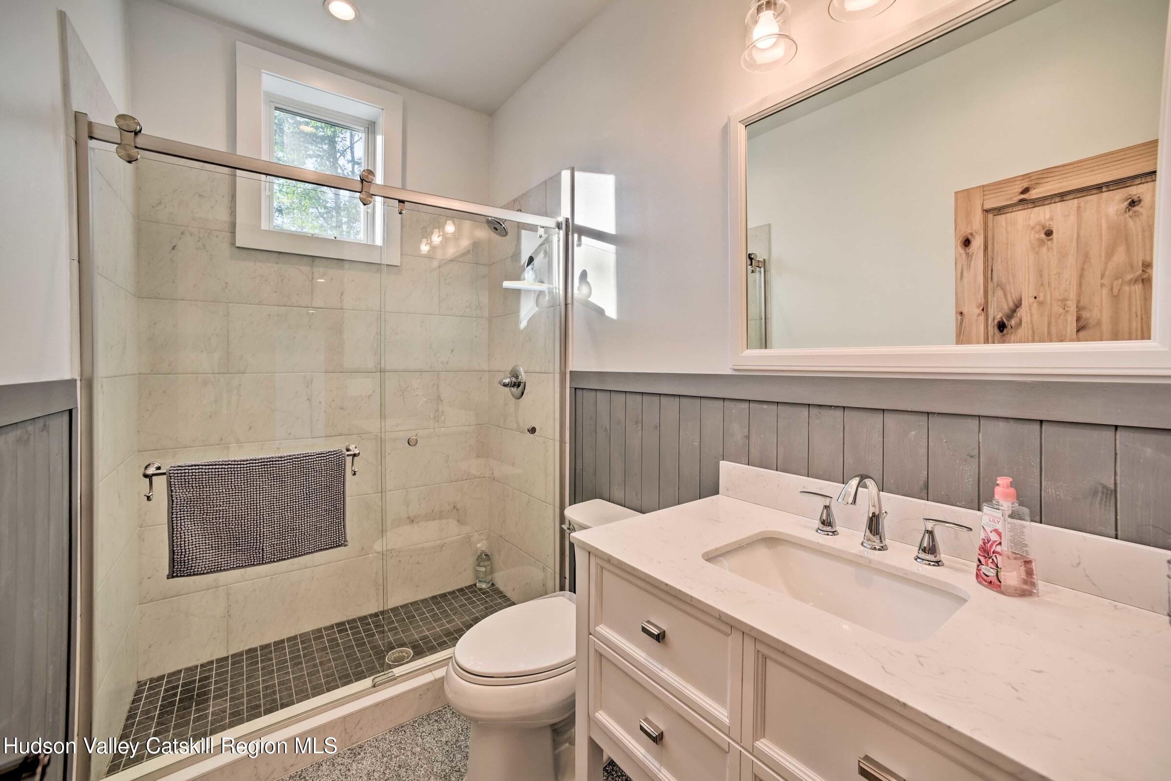 205 Nauvoo Road Windham, NY 12496 - Photo 24 of 31 a bathroom with a sink toilet and shower