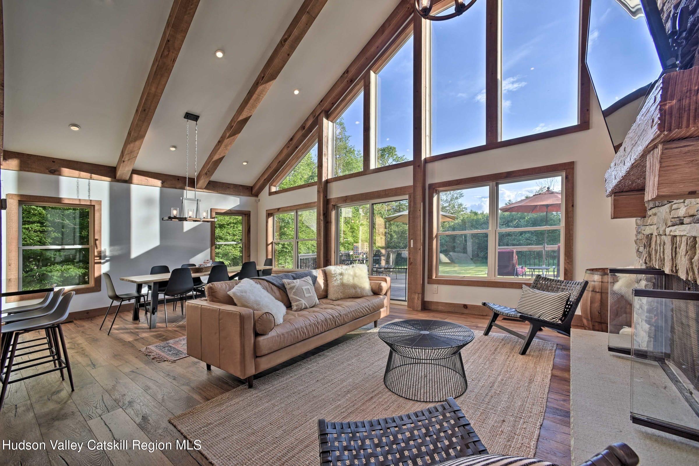 205 Nauvoo Road Windham, NY 12496 - Photo 8 of 31 a living room with furniture and a large window