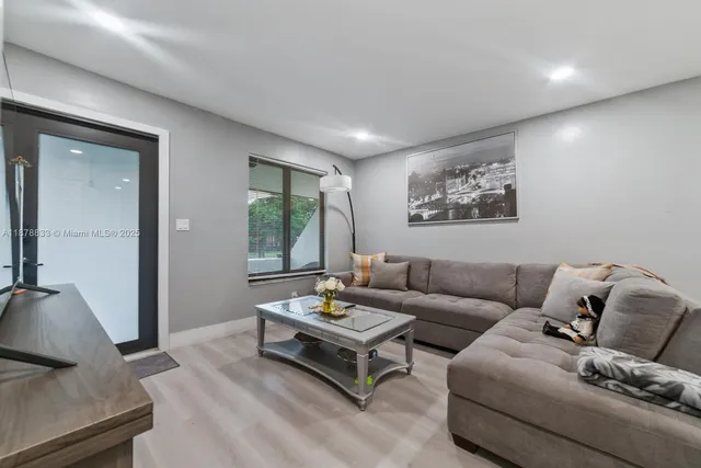 a living room with furniture and a window