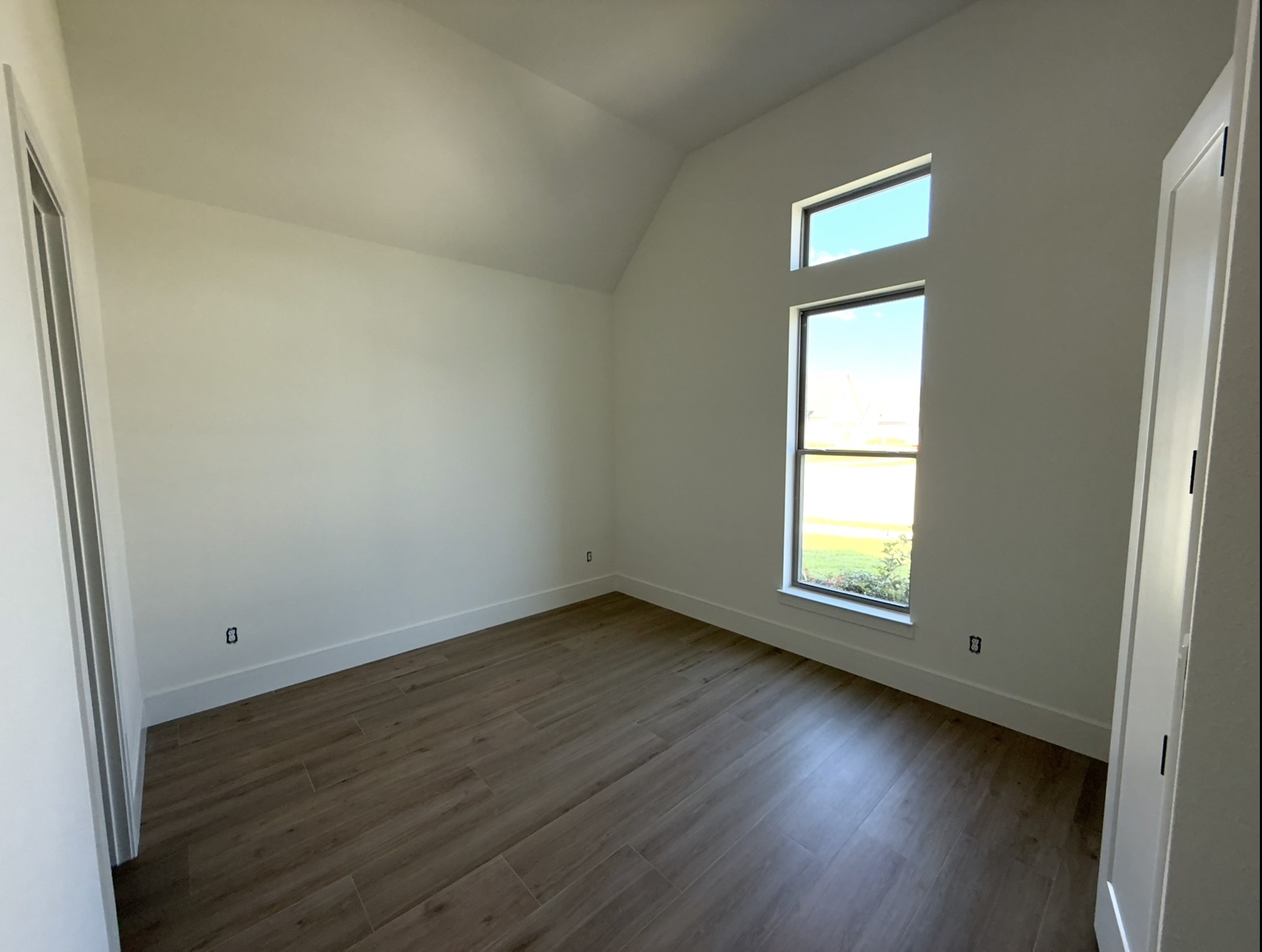 3541 Lily Lane Beaumont, TX 77713 - Photo 12 of 12 an empty room with wooden floor and windows