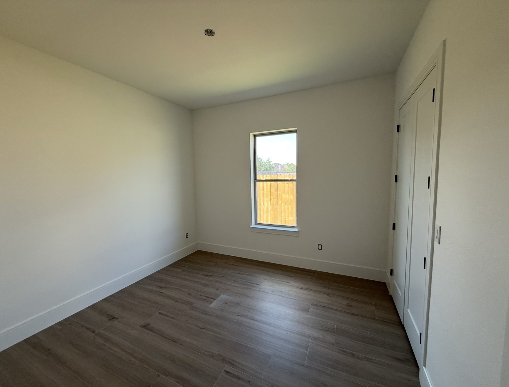 3541 Lily Lane Beaumont, TX 77713 - Photo 10 of 12 a view of empty room with wooden floor and fan