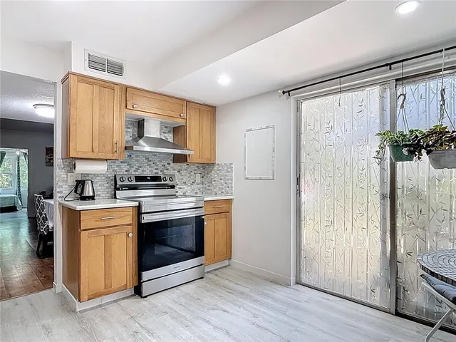 a view of kitchen with furniture and wooden floor