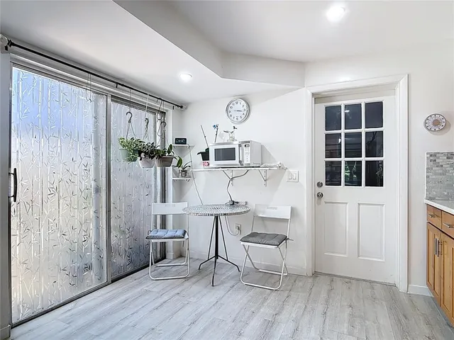 a kitchen with a stove and a refrigerator