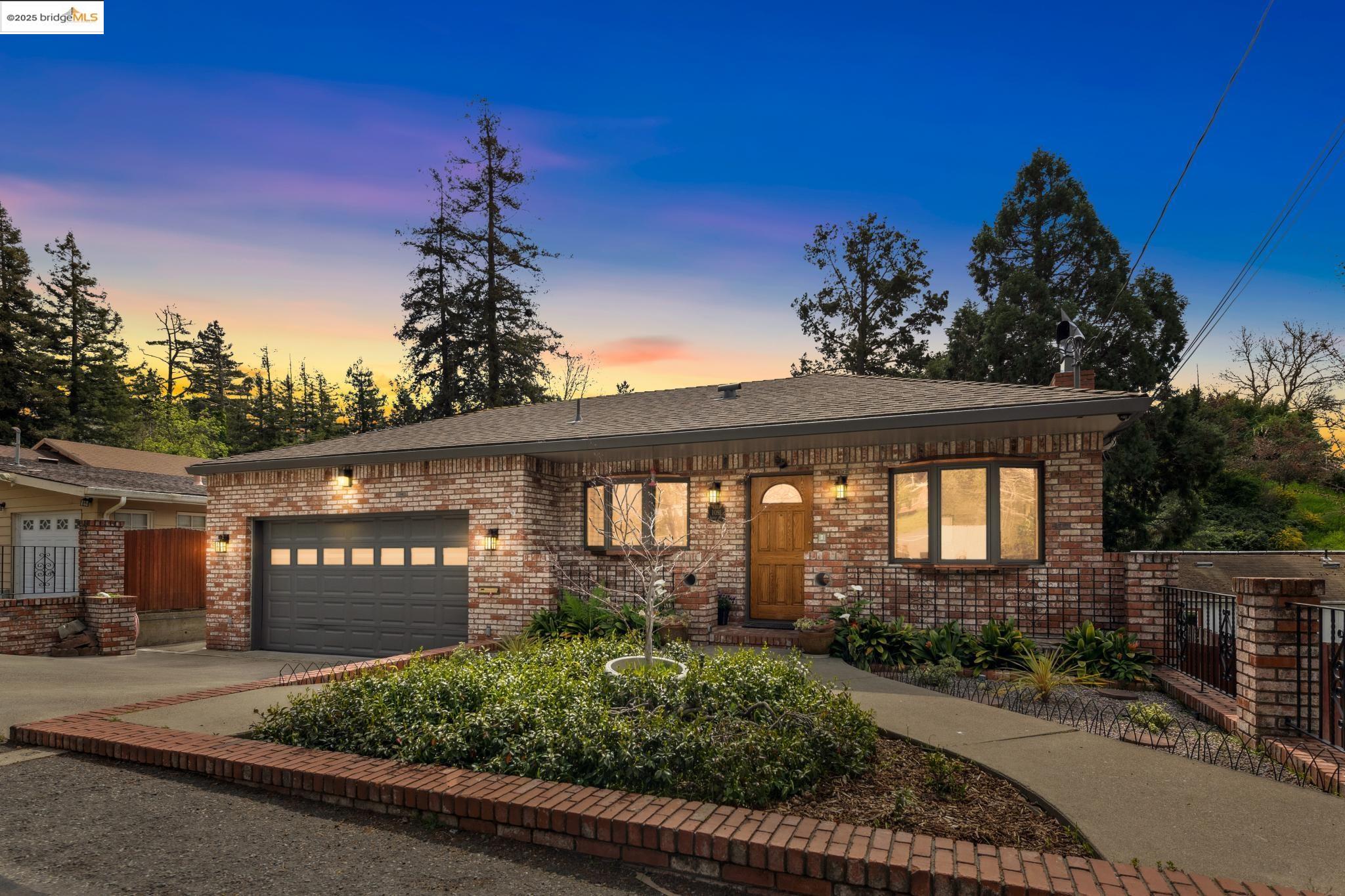 1091 Manor Road El Sobrante, CA 94803 - Photo 1 of 1 a front view of a house with a yard