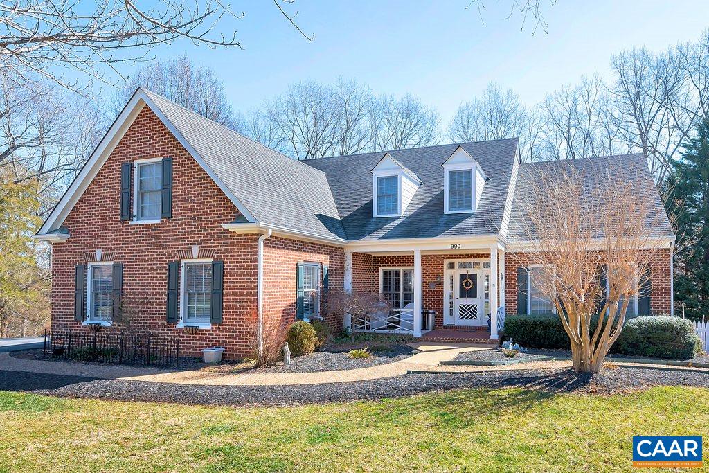 a view of house with sink yard and swimming pool
