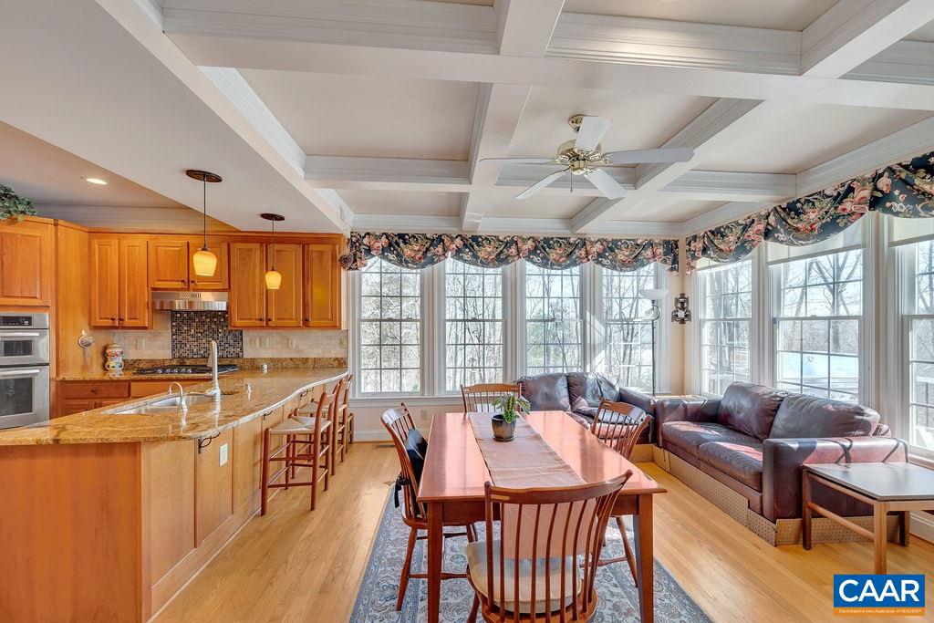 1990 River Inn Lane Charlottesville, VA 22901 - Photo 12 of 48 a living room with furniture a large window and wooden floor