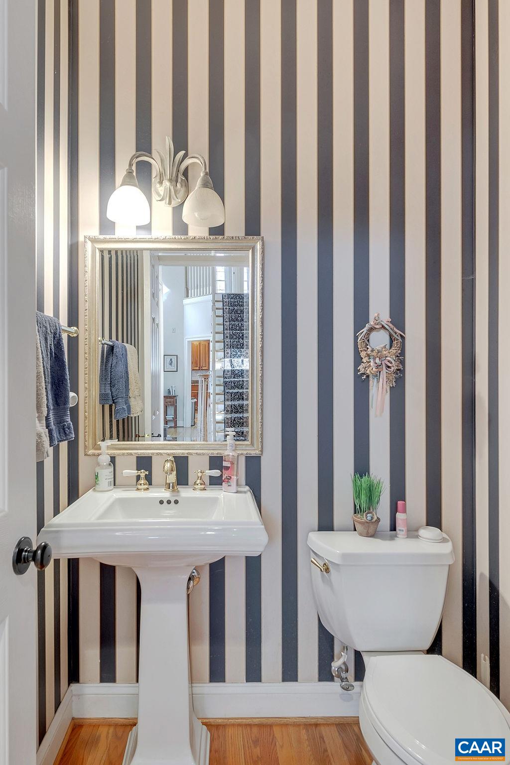 1990 River Inn Lane Charlottesville, VA 22901 - Photo 23 of 48 a bathroom with a granite countertop sink and a mirror with toilet