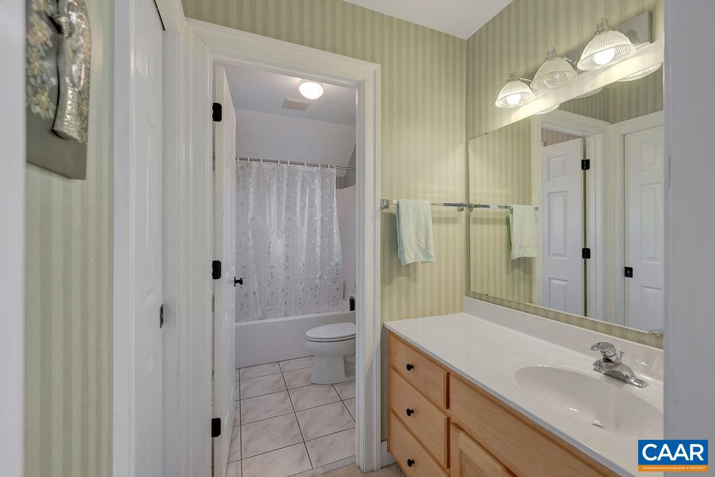 1990 River Inn Lane Charlottesville, VA 22901 - Photo 29 of 48 a bathroom with a shower sink and mirror