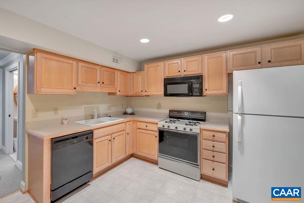 1990 River Inn Lane Charlottesville, VA 22901 - Photo 31 of 48 a kitchen with cabinets stainless steel appliances and a sink