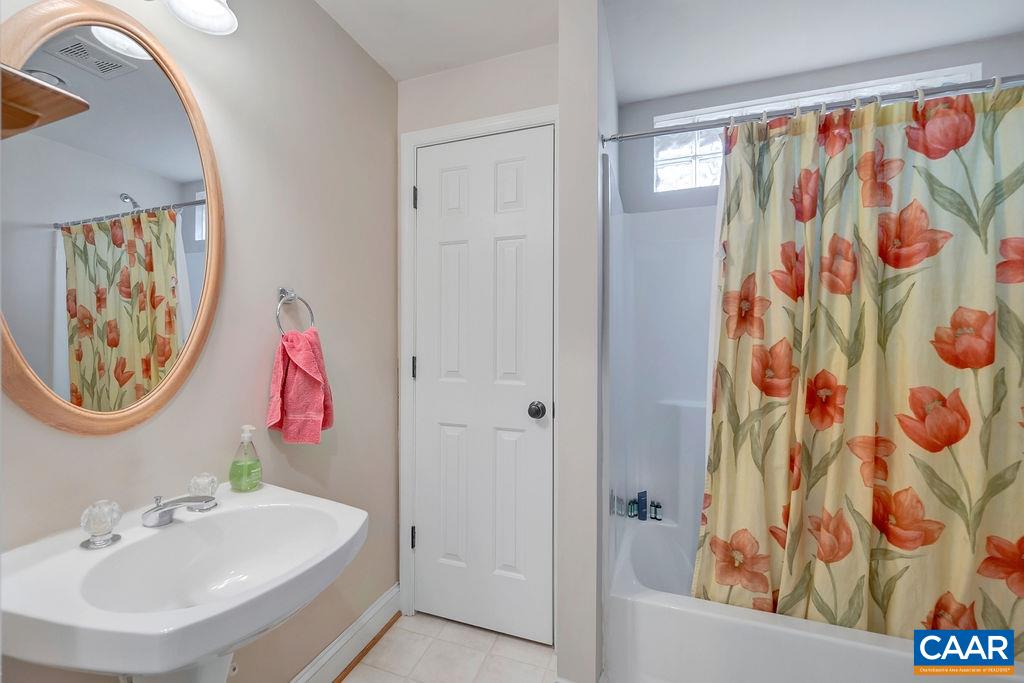 1990 River Inn Lane Charlottesville, VA 22901 - Photo 35 of 48 a bathroom with a sink and a mirror