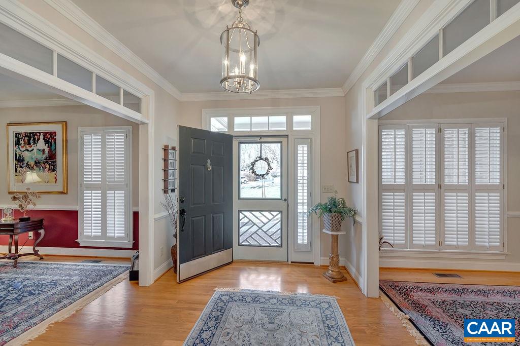1990 River Inn Lane Charlottesville, VA 22901 - Photo 4 of 48 a living room with furniture and a chandelier
