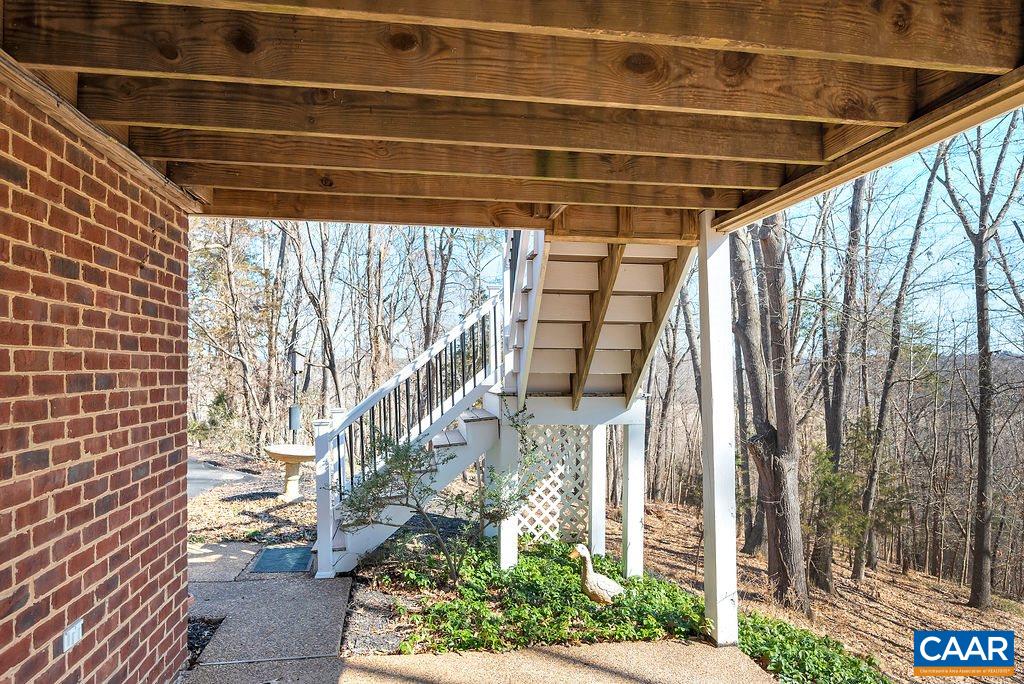 1990 River Inn Lane Charlottesville, VA 22901 - Photo 42 of 48 a view of entryway with wooden wall and potted plants