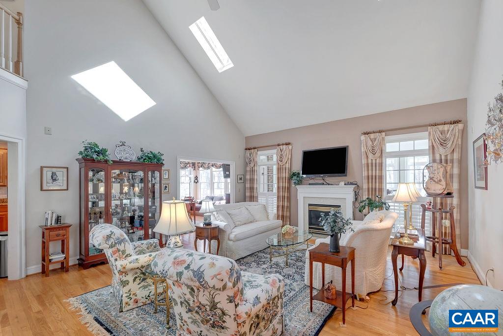 1990 River Inn Lane Charlottesville, VA 22901 - Photo 5 of 48 a living room with fireplace furniture and a flat screen tv