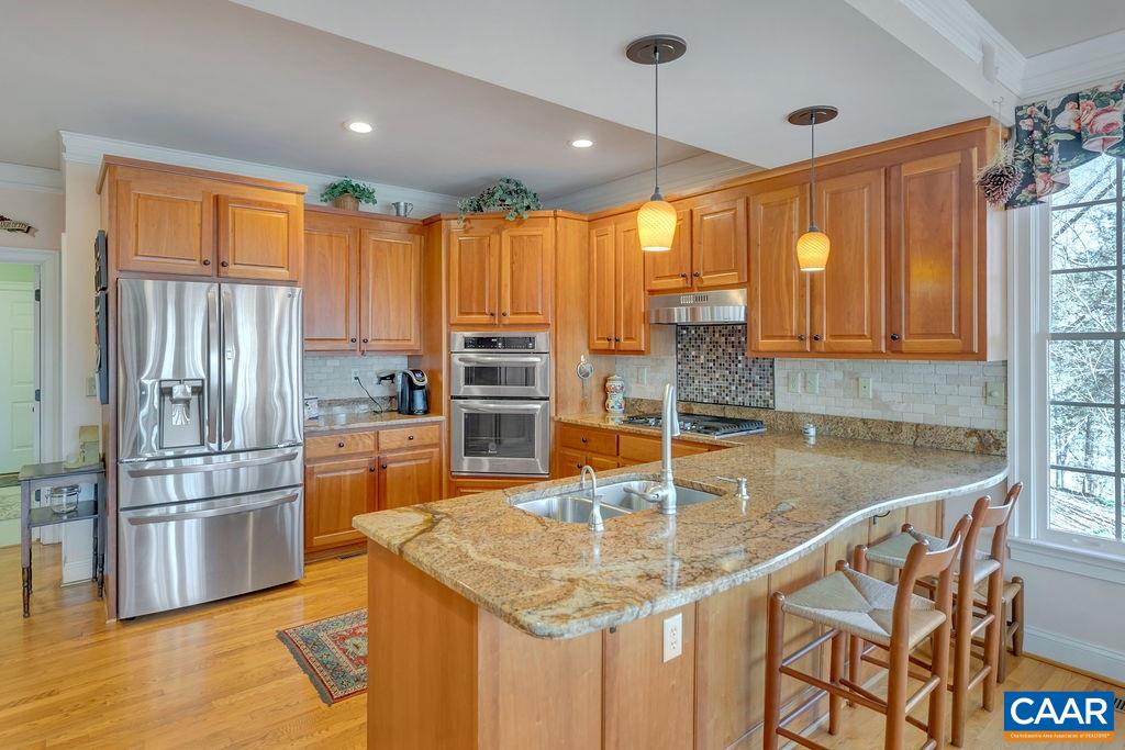 1990 River Inn Lane Charlottesville, VA 22901 - Photo 9 of 48 a kitchen with stainless steel appliances granite countertop a refrigerator a sink and a stove