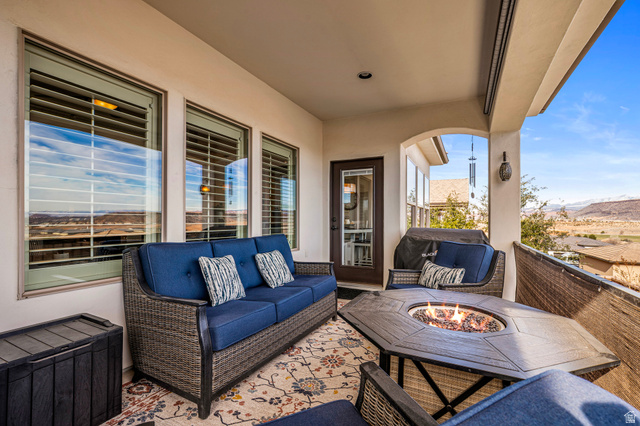 2311 South 1340 West St. George, UT 84770 - Photo 22 of 56 Patio / terrace featuring an outdoor living space with a fire pit and a mountain view