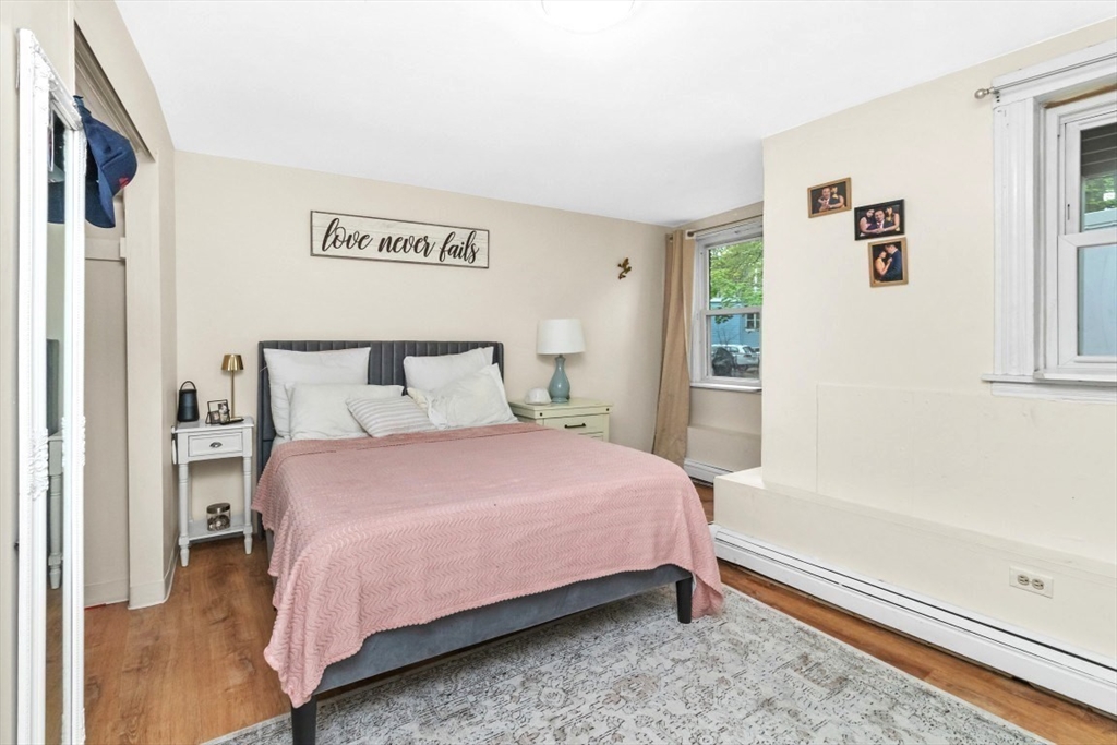 8 Colliston Road Boston, MA 02135 - Photo 25 of 40 a bedroom with a bed and window