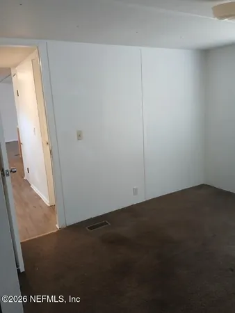 an empty room with a bench