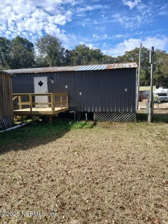 a view of a backyard of the house