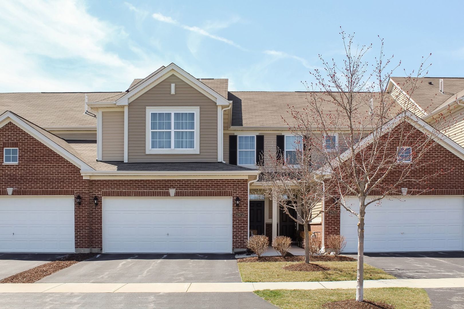 2972 Church Road Aurora, IL 60502 - Photo 1 of 1 a front view of a house with a yard and garage