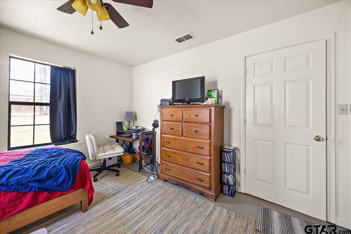 110 Earl Street Rusk, TX 75785 - Photo 18 of 29 a bedroom with a bed and a television