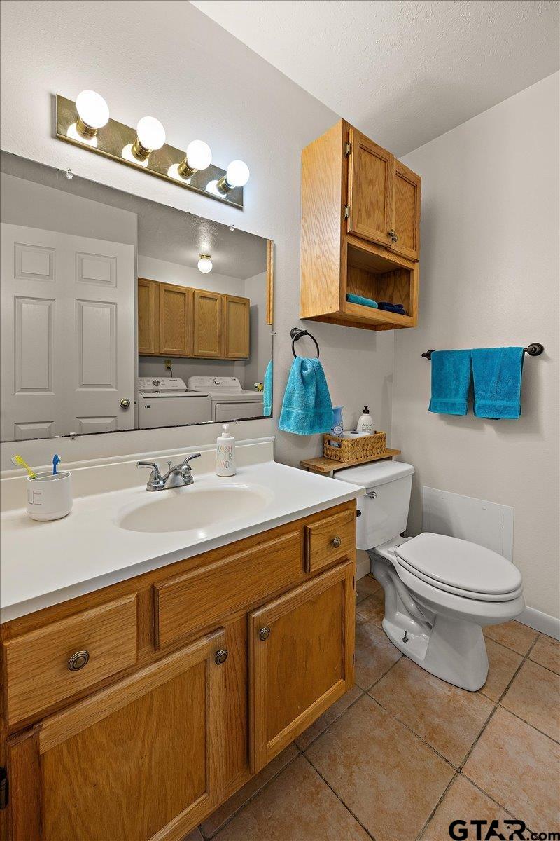 110 Earl Street Rusk, TX 75785 - Photo 19 of 29 a bathroom with a toilet sink and mirror
