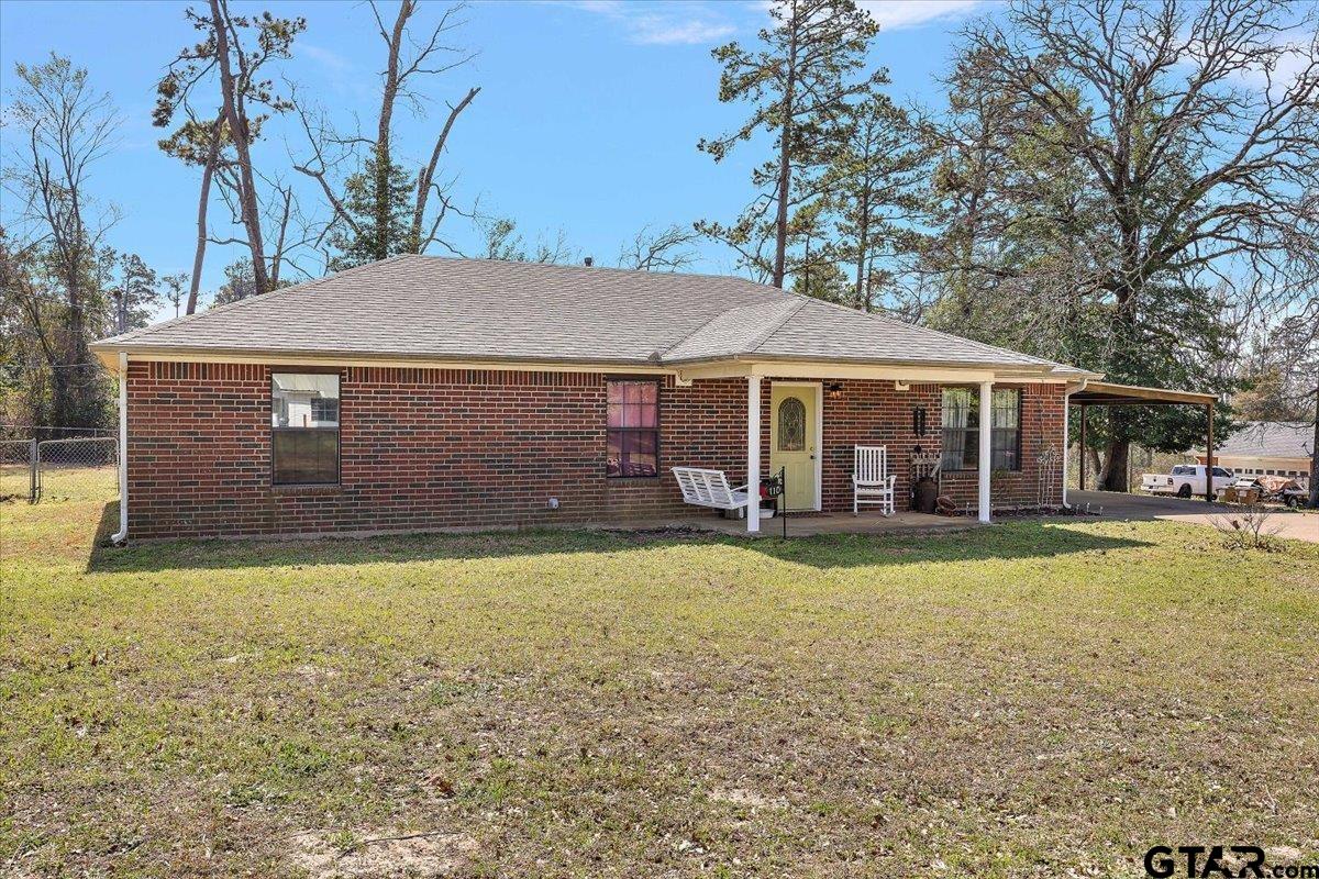 110 Earl Street Rusk, TX 75785 - Photo 2 of 29 a front view of a house with swimming pool
