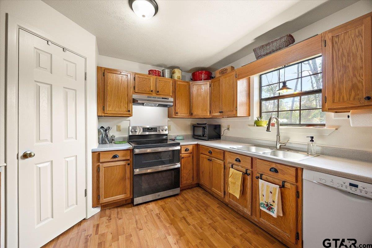 110 Earl Street Rusk, TX 75785 - Photo 10 of 29 a kitchen with stainless steel appliances granite countertop a sink stove and refrigerator