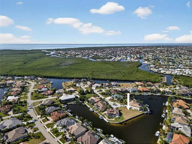 an aerial view of a residential houses with outdoor space